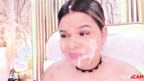 ”chubby hottie with fake cum on her face sucks a big dildo”