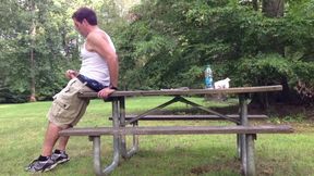 Milking in the public park next to the busy road.