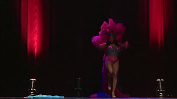 Sultry black white burlesque performer gives head