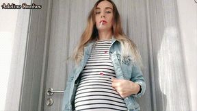Smoking a cigarette in a denim jacket - pregnant 8 months