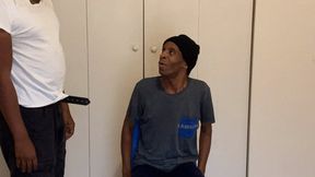 Guy gets spanked with a wooden spoon over the knee