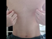 A perverted masochistic man masturbates by pulling his nipples