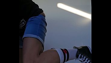 Masturbator in short jeans, white socks and converse sneakers