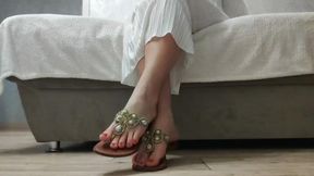 Beautiful decorated flip flops on Lolly's charming feet