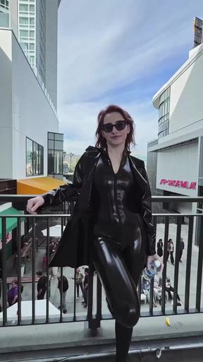 Leather-clad woman posing on bridge