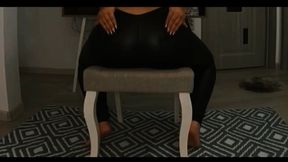 Big ass in leggings farting on a chair