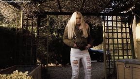 Lillie wets her jeans in the garden