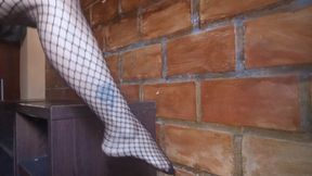 Roxan with her beautiful crossed legs and bare feet wearing fishnet stockings (3)