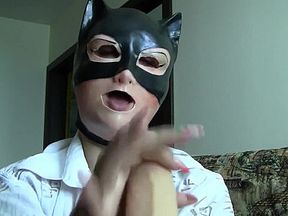 Girl in Female Mask Sucks on Dildo