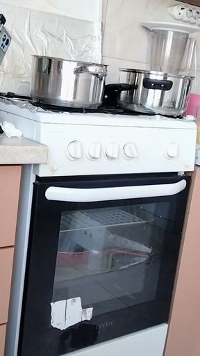 Sexy Latina nude in the kitchen. Sexy naked wife prepares food in the kitchen.   Clip 1