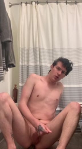 Twink shows off, plays with his hard cock and fucks his ass with a dildo until he cums