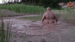 Dirt bathtub in deep quarry mess pond