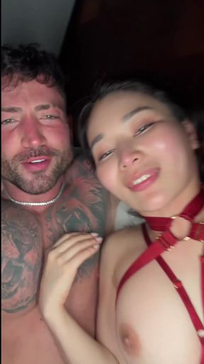 Busty Asian porn star shows off her juicy jugs in an interracial scene