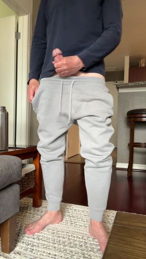 Showing my cock budge in gray sweatpants and then taking my cock out and stroking and showing it. Barefoot in gray sweats playing with my dick and jerking. Showing my thick mushroom head cock.