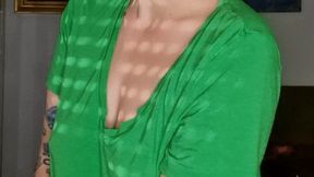 Smoking in a green shirt without bra