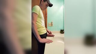 Watch this chubby guy stroke his fat cock in a bathroom while getting off solo