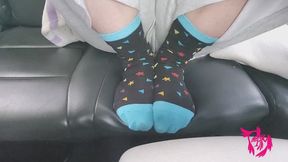 Blowing Smoke over Cute Sock Feet