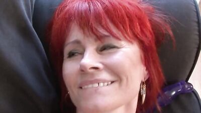 Slutty mature lady is fucked on the couch by a black stallion