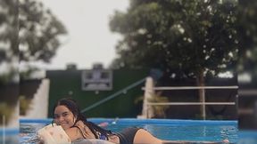 Pool toys and Carmen playing in the pool