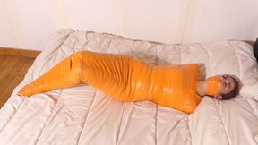 The mummification of Anael in orange tape!