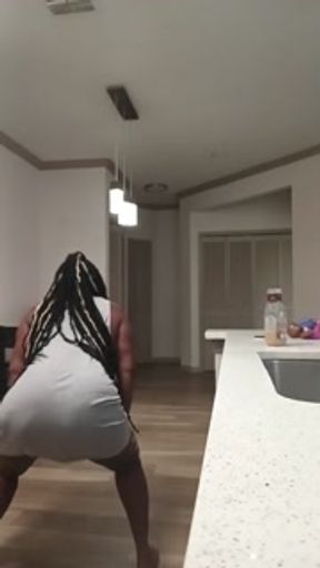 His wife in the kitchen twerking