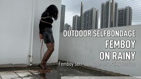 Femboy self-bondage on a rainy rooftop