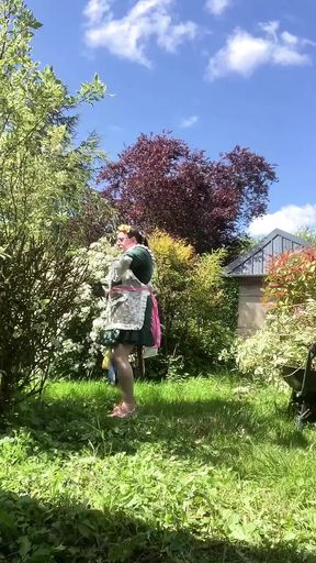 In a planter&#039;s outfit for pruning shrubs