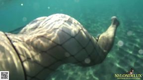 fishnet stocking in public sea and beach