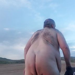 Fat guy naked in the mountains