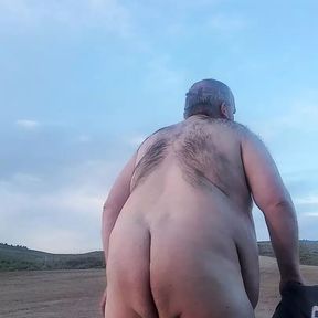 Fat guy naked in the mountains