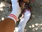 Outdoor food fruit crush with white socked feet