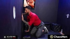 Tatted Stud Sucks BBC Through Gloryhole