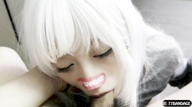 White-haired girl deepthroats a china doll in uniform