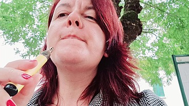 Sexy chubby readhead smoke in a garden