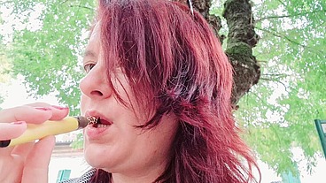 Sexy chubby readhead smoke in a garden