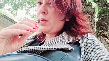 Sexy chubby readhead smoke in a garden