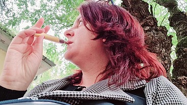 Sexy chubby readhead smoke in a garden