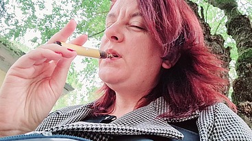 Sexy chubby readhead smoke in a garden
