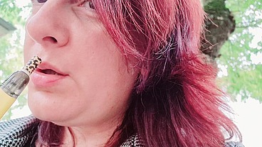 Sexy chubby readhead smoke in a garden