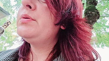 Sexy chubby readhead smoke in a garden
