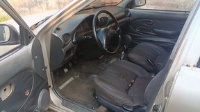 This woman masturbates while smoking a cigarette and pumping old car pedals (3)