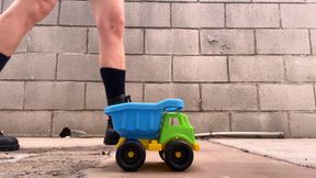 Crushing Toy Truck in Combat Boots (close-up)