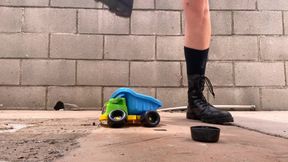 Crushing Toy Truck in Combat Boots (close-up)