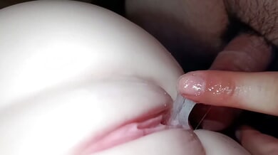 Young woman's pink pussy teased by a finger in intimate close-up