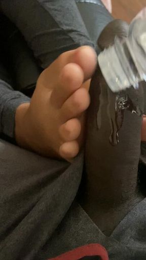 Shy footjob from a models sister under covers sneaky cumshot