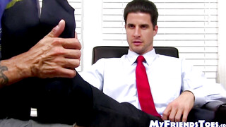 Hunky guy in a suit has his feet and toes licked sensually