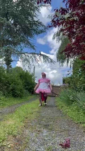 Dressed in her new pink maid outfit for a day