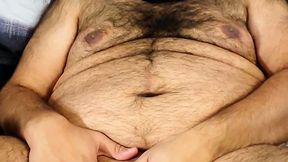Masked bear jerking off in bed
