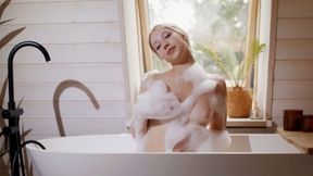 Blonde teen displays soapy naked figure