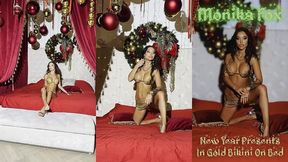 monika fox new year presents in gold bikini on bed